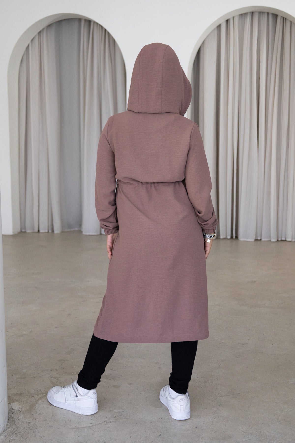 Elegant and modest, The Haya Coat is a timeless girls’ coat designed for comfort and effortless everyday style. Featuring a longline silhouette, hood, adjustable waist and versatile mocha colour, it’s the perfect layer for every occasion.