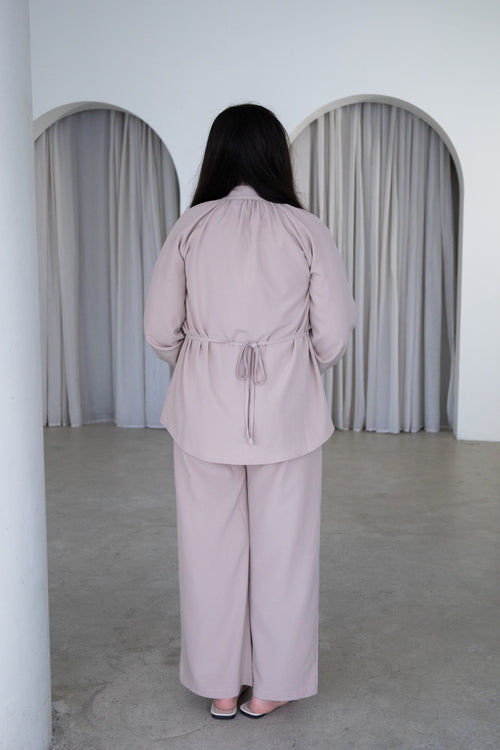 Elegant and effortlessly modest, The Liyana Set is a timeless two-piece outfit designed for comfort and style. Featuring a longline blouse with delicate pearl-look buttons and softly gathered sleeves, paired with relaxed wide-leg pants, it’s perfect for Eid, special occasions, family gatherings and everyday wear.