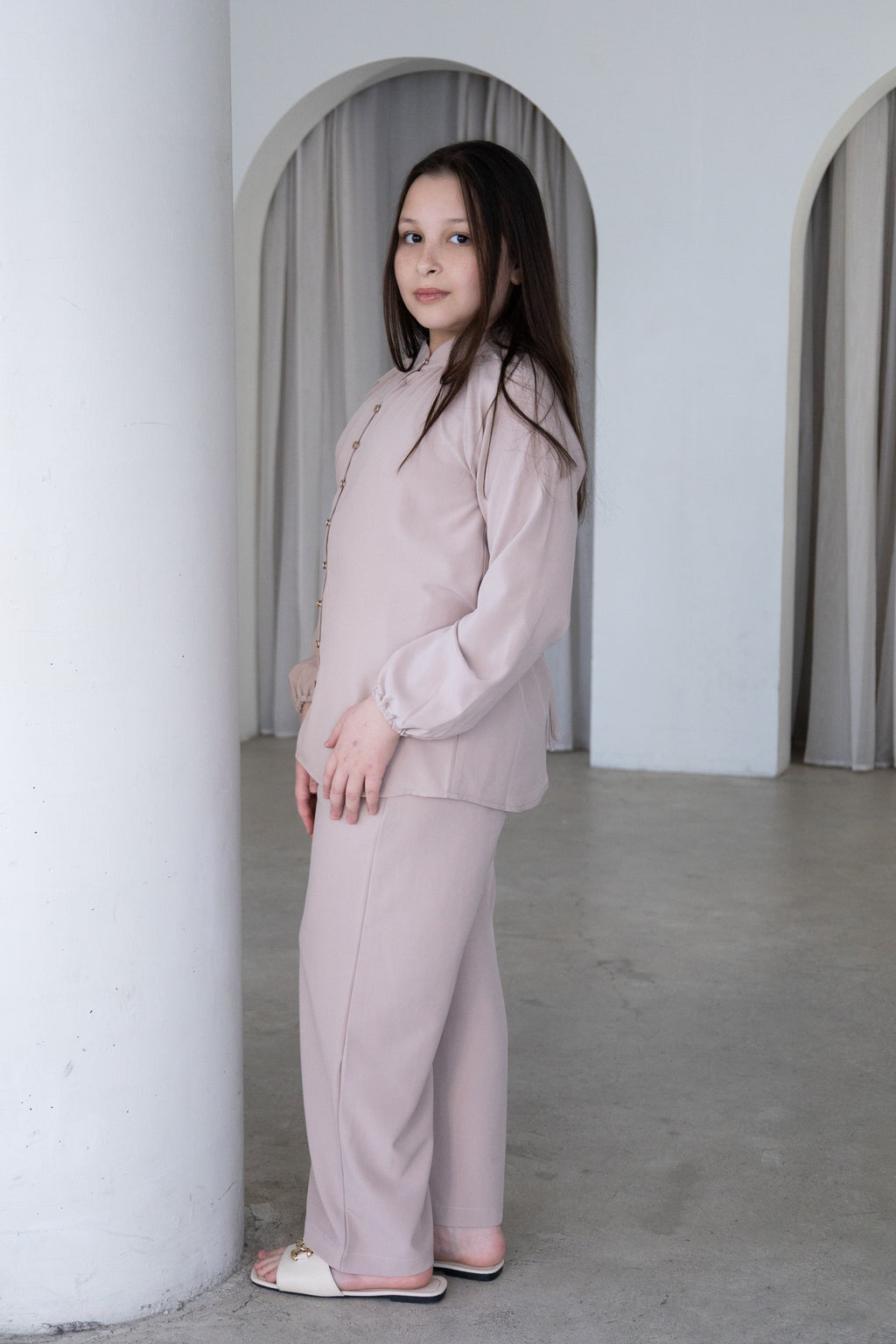 Elegant and effortlessly modest, The Liyana Set is a timeless two-piece outfit designed for comfort and style. Featuring a longline blouse with delicate pearl-look buttons and softly gathered sleeves, paired with relaxed wide-leg pants, it’s perfect for Eid, special occasions, family gatherings and everyday wear.