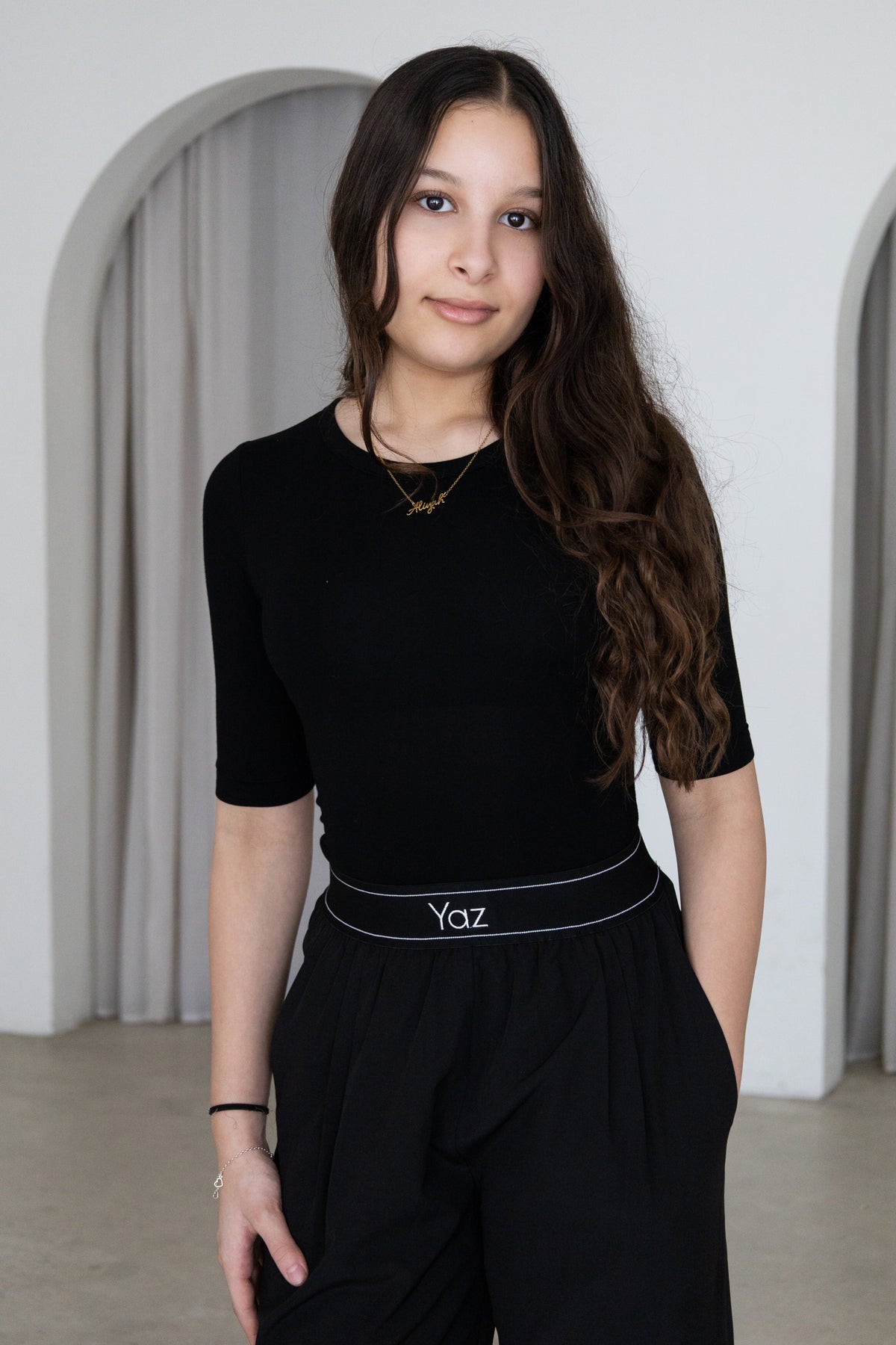 Elegant and versatile, The Noor Top is a timeless modest wardrobe essential designed for effortless everyday style. Featuring a fitted silhouette, classic round neckline and elegant three-quarter sleeves, it pairs beautifully with The Yaz Pants or any Yaz & Co. piece for endless styling options.