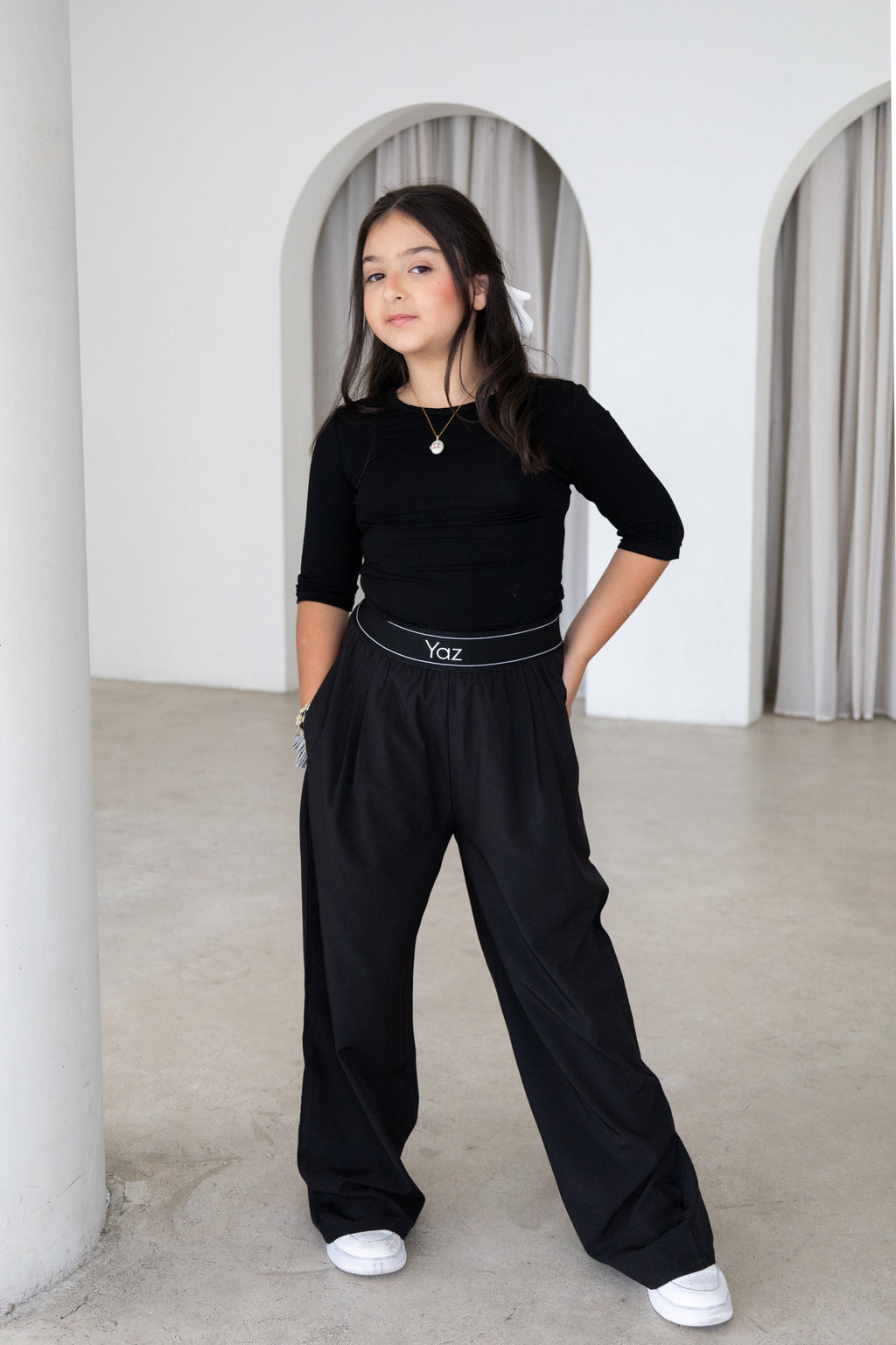 Elegant and versatile, The Noor Top is a timeless modest wardrobe essential designed for effortless everyday style. Featuring a fitted silhouette, classic round neckline and elegant three-quarter sleeves, it pairs beautifully with The Yaz Pants or any Yaz & Co. piece for endless styling options.