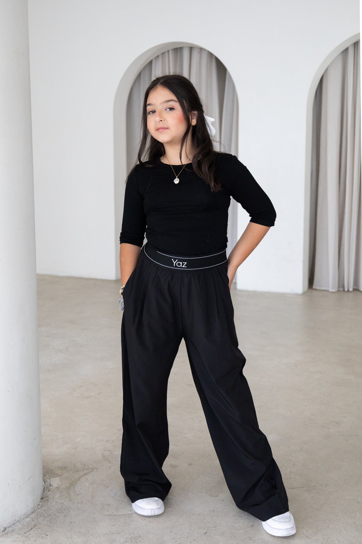 Elegant and versatile, The Noor Top is a timeless modest wardrobe essential designed for effortless everyday style. Featuring a fitted silhouette, classic round neckline and elegant three-quarter sleeves, it pairs beautifully with The Yaz Pants or any Yaz & Co. piece for endless styling options.