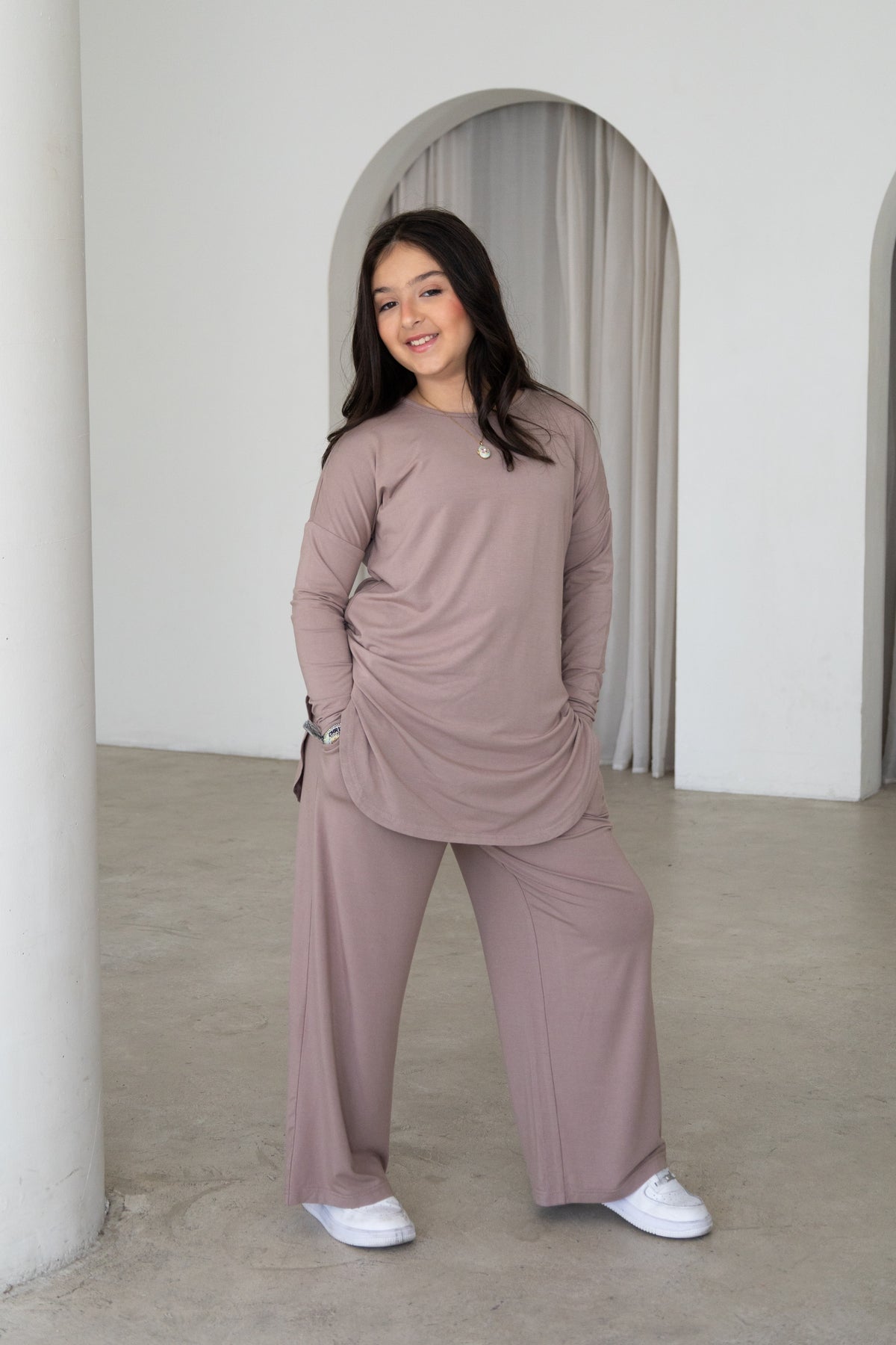 Effortless and modest, The Yasmin Set is a timeless two-piece outfit designed for comfort and everyday style. Featuring a relaxed longline tunic and flowing wide-leg pants in a versatile mocha hue, it’s perfect for Eid, family gatherings, outings and everyday wear.